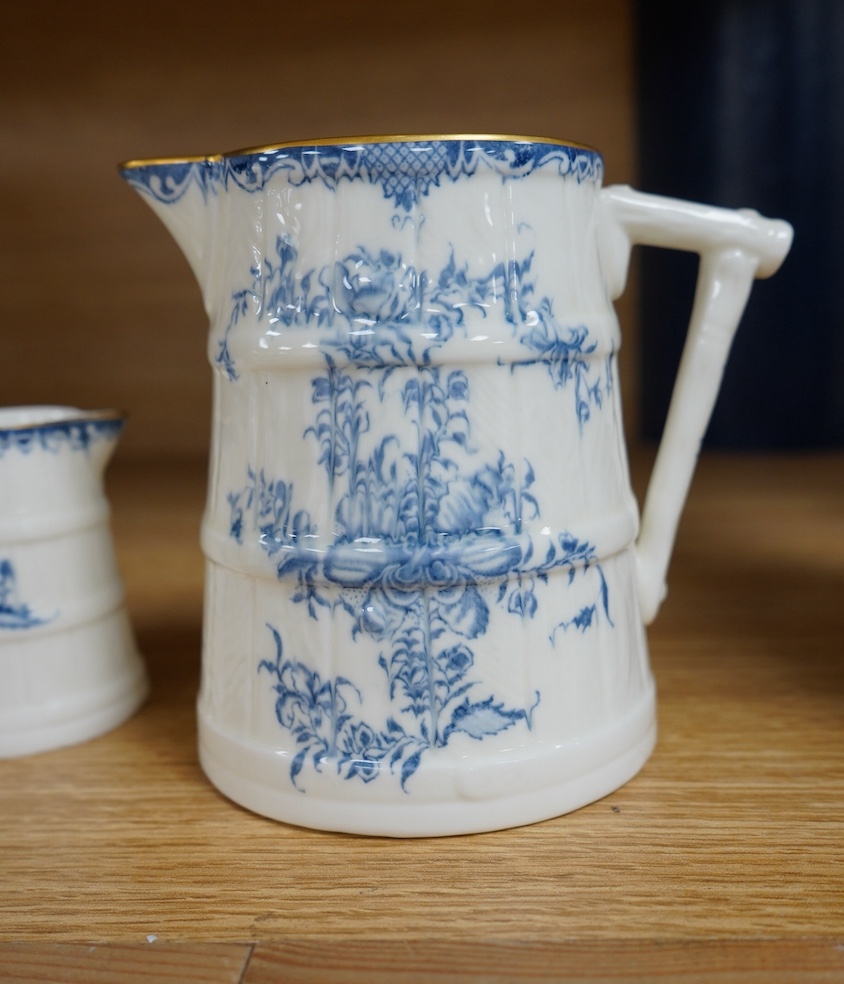 A graduated set of four Royal Worcester blue and white jugs, tallest 11cm. Condition - good.